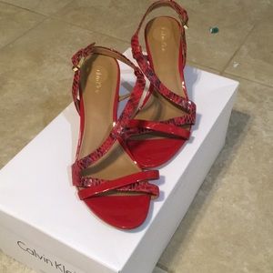 Calvin Klein Red/ snake print heels.